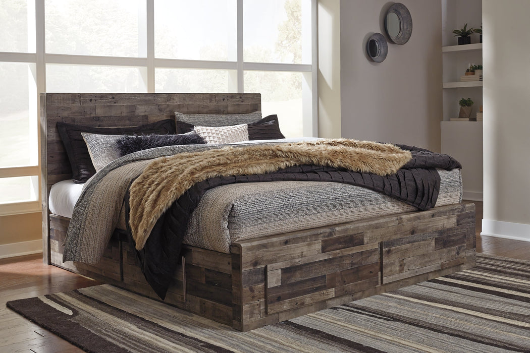 Derekson King Panel Bed with 6 Storage Drawers with Mirrored Dresser and Chest Homeline Furniture