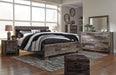 Derekson King Panel Bed with Mirrored Dresser, Chest and Nightstand Homeline Furniture