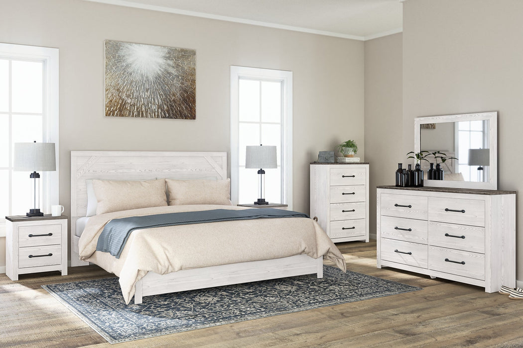 Gerridan King Panel Bed with Mirrored Dresser, Chest and 2 Nightstands Homeline Furniture